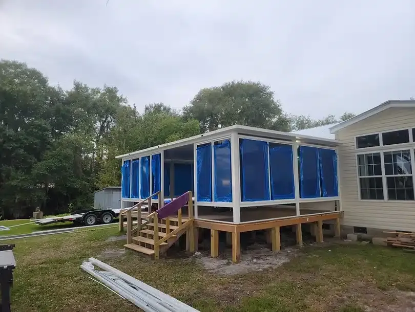 Aluminum framing in progress during a porch screen enclosure installation