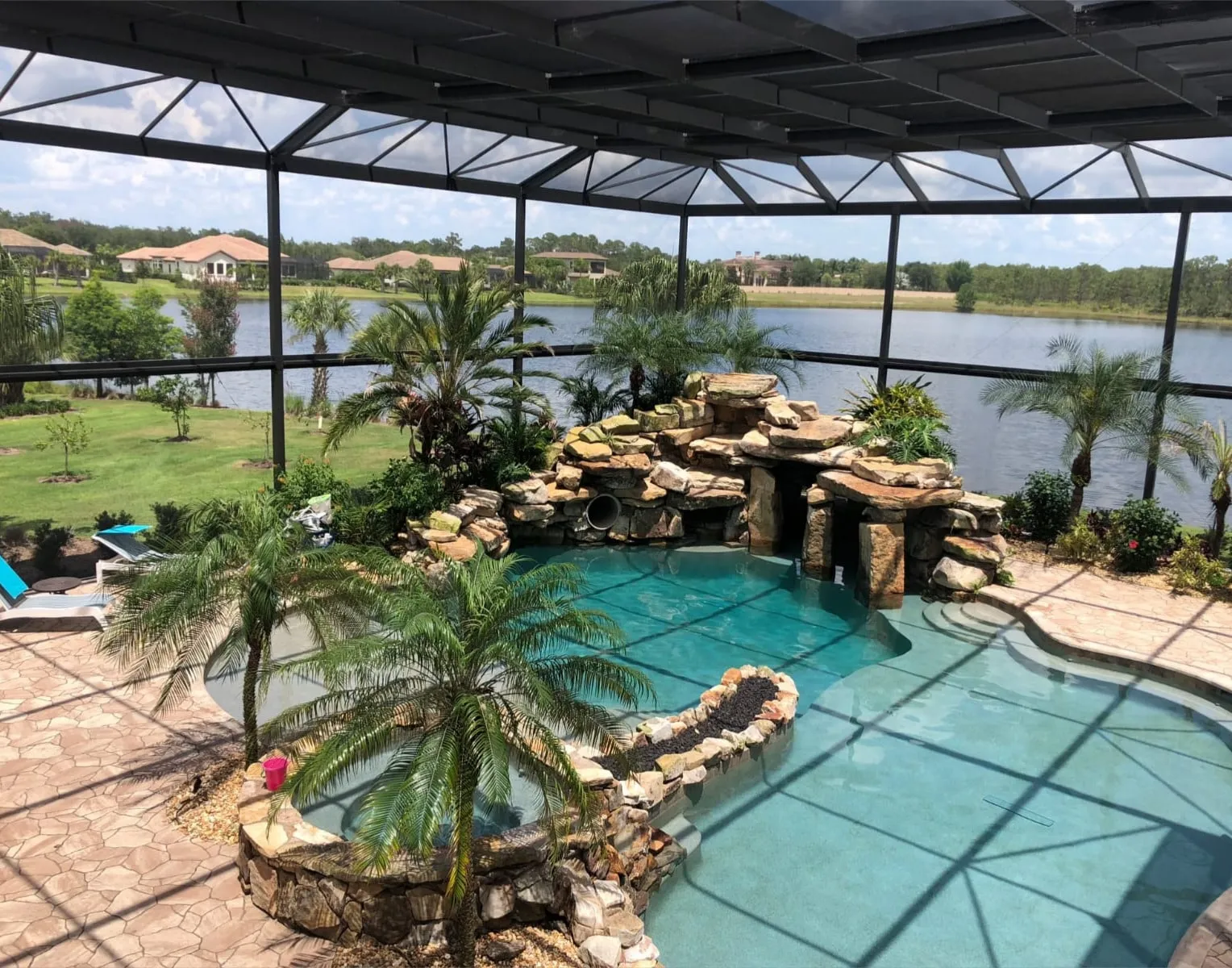 Custom swimming pool with rock waterfall feature