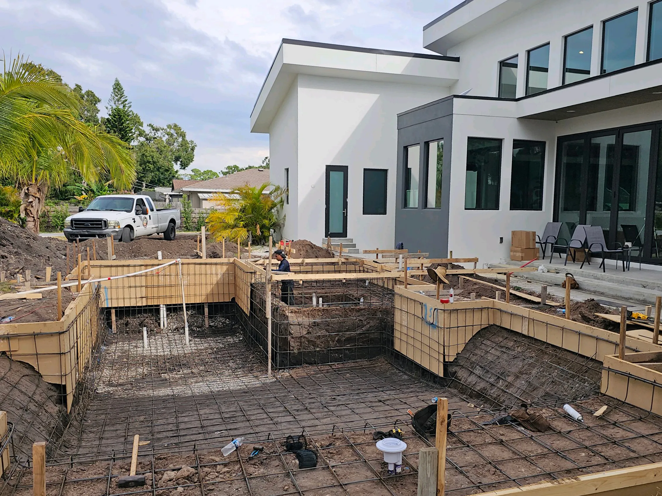 Pool excavation and structural framing in progress