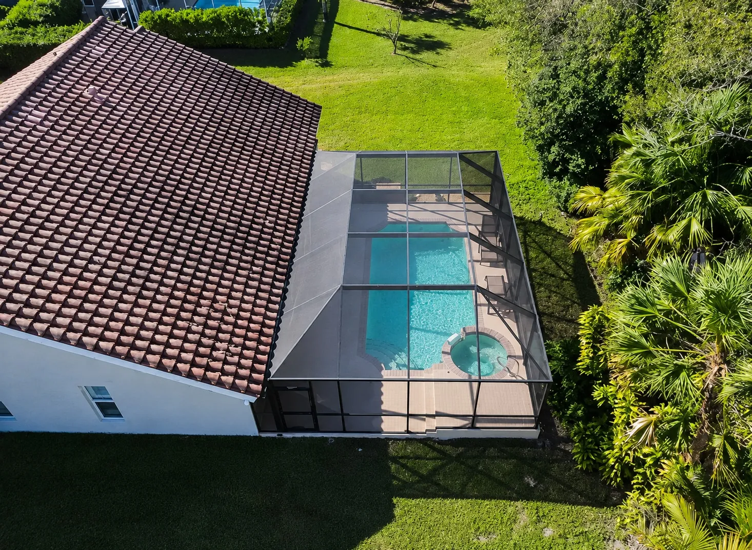 Aerial view of a rescreened pool cage in Florida