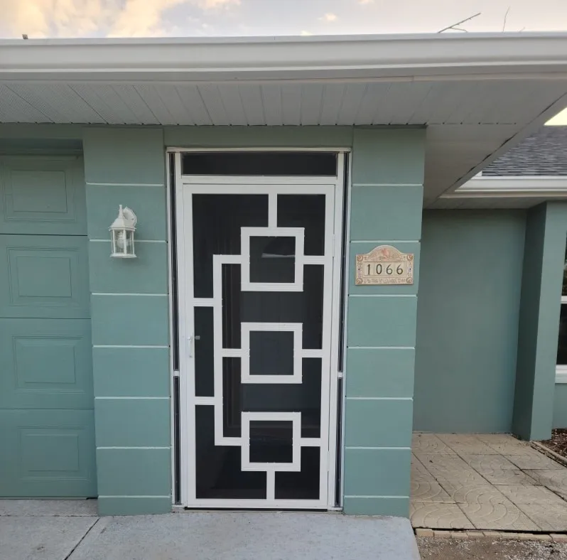 Front entry screen enclosure with decorative door on a Florida home
