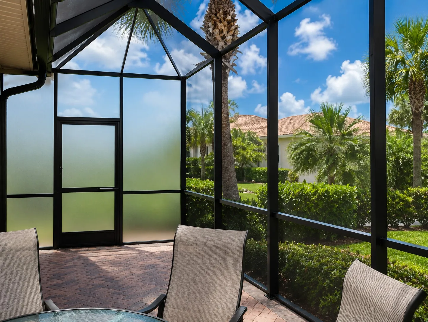 Lanai with a translucent privacy screen wall and door installed beside open mesh panels