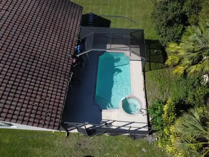 Torn pool screens after hurricane — before pool screen repair in West Coast Florida
