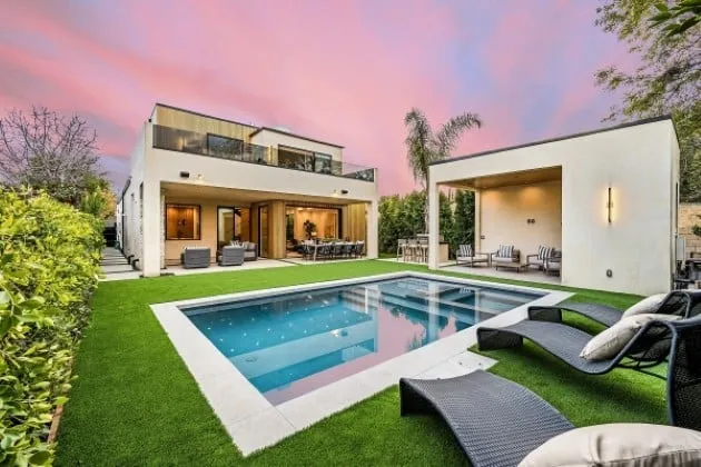 Modern custom swimming pool at sunset in a Sarasota backyard