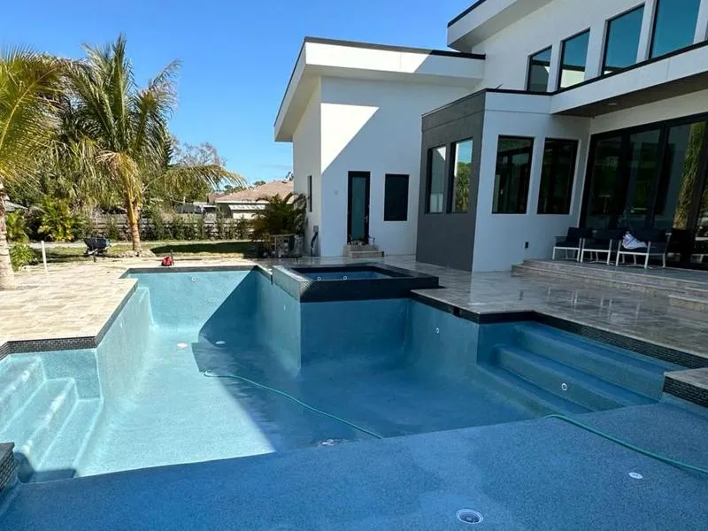 Modern swimming pool with built-in spa, completed