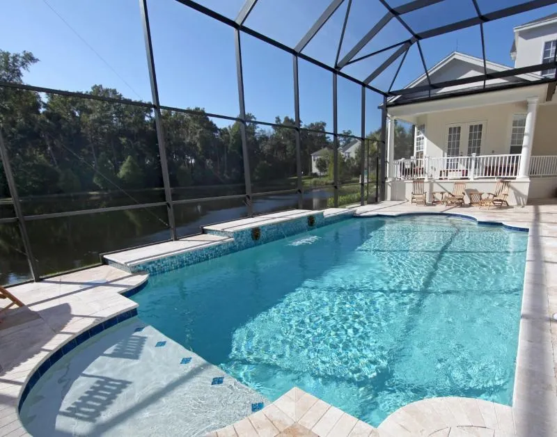 Remodeled pool with enhanced curves, upgraded tile and a sun shelf