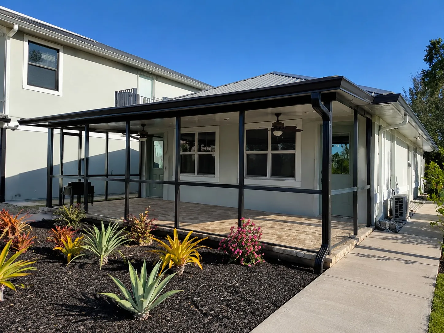 Screened porch before the Clear View conversion, with horizontal and vertical bars crossing the panels