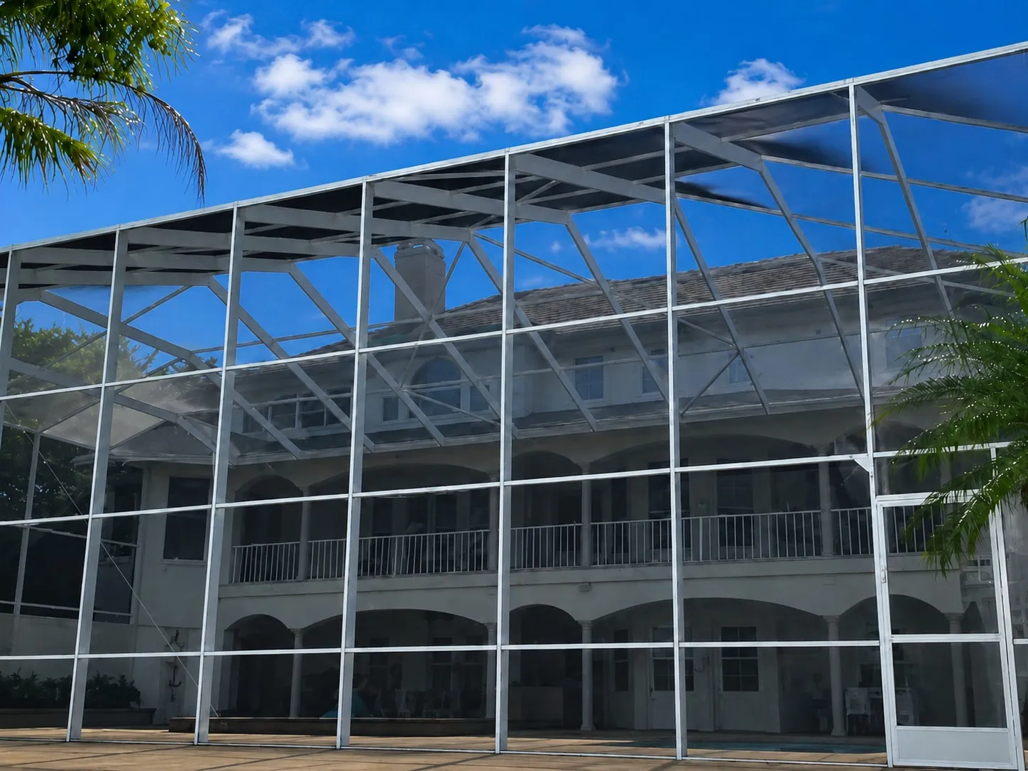 Aluminum pool cage fully restored — large enclosure repair completed by Forge Point Contracting LLC in West Coast Florida