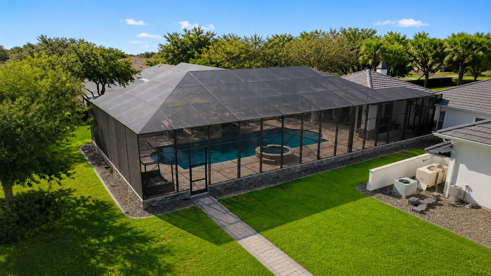 The same pool cage rescreened, with clean new mesh on every panel
