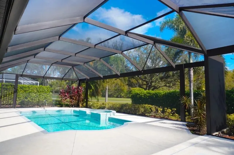 Screened pool cage enclosure in Florida with modern aluminum framing, ideal for insect protection and outdoor living.