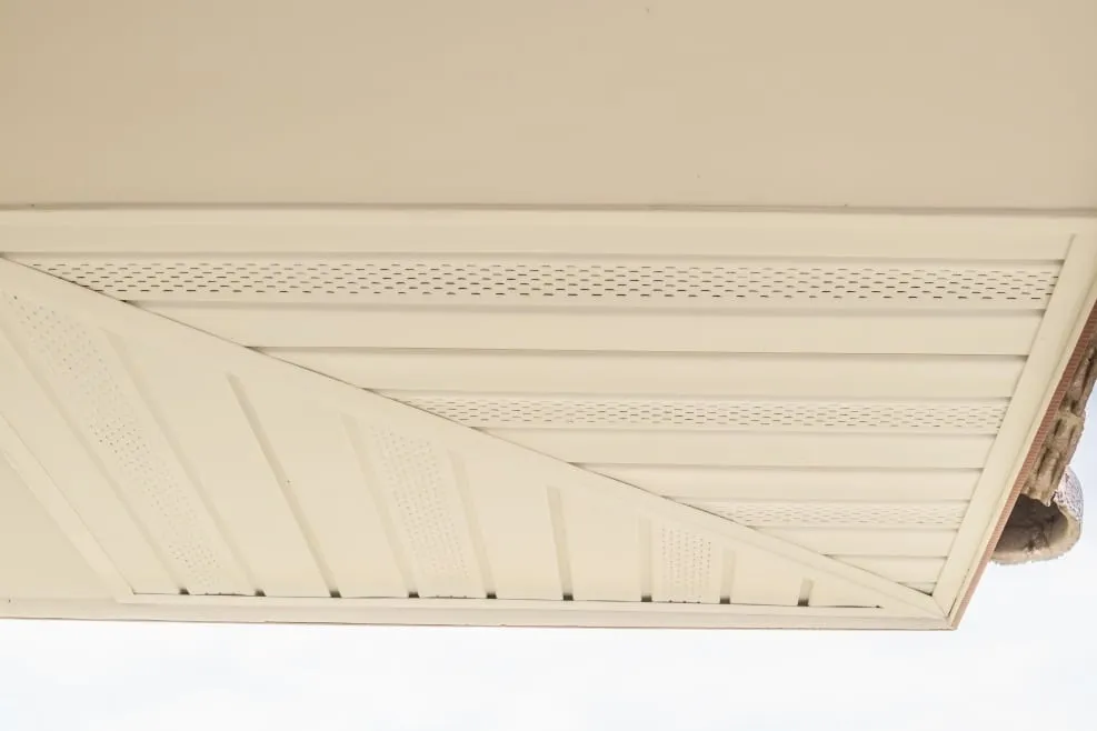 White aluminum soffit installed under the roofline of a Florida home
