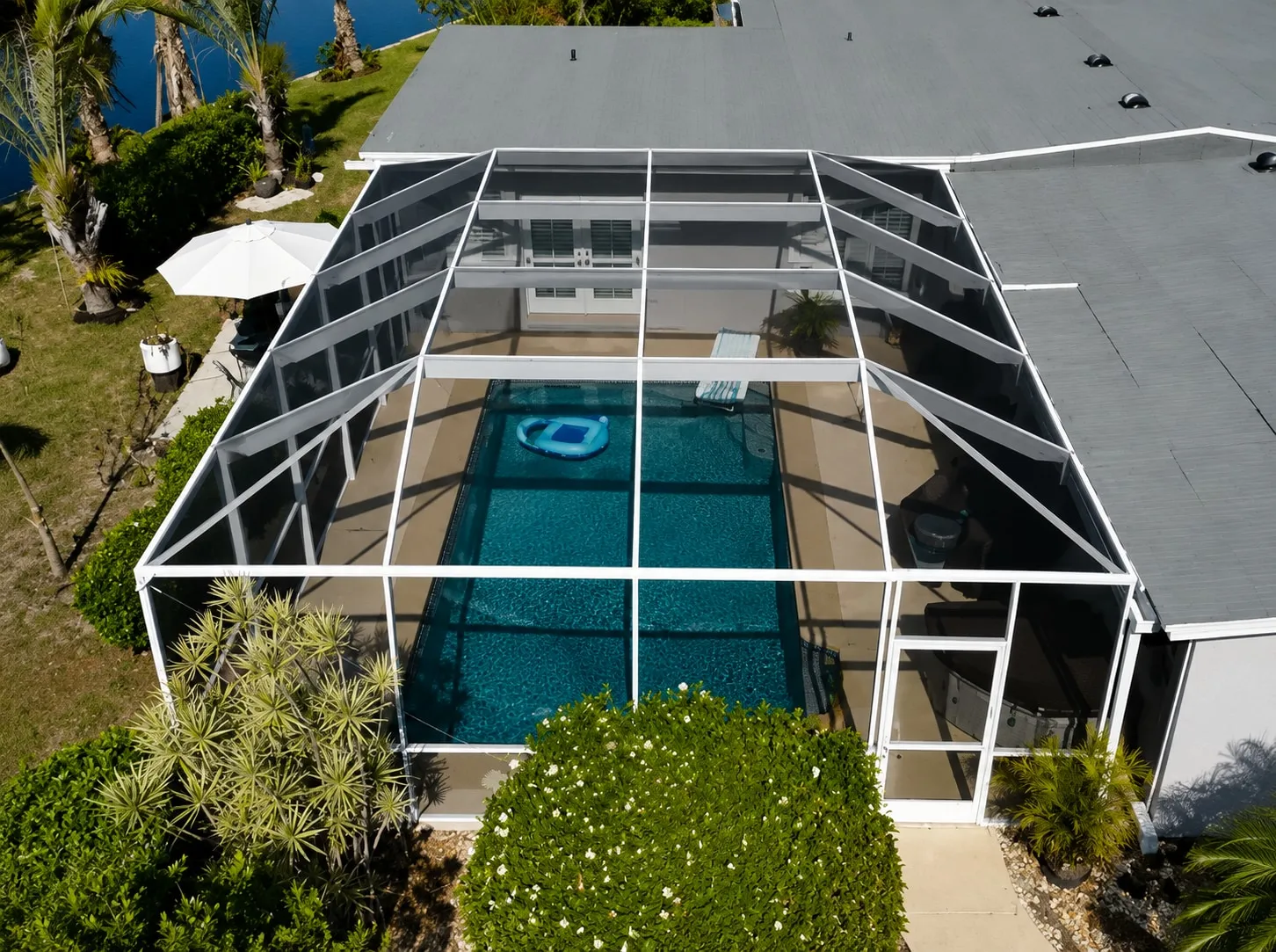 Pool cage screen repair completed in Cape Coral — multi-panel mesh replacement